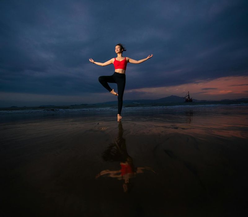 Silhouette of a person meditating at sunset.